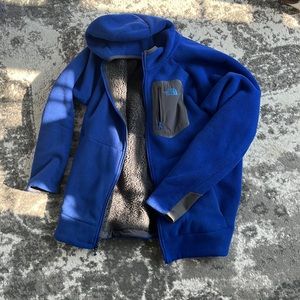 Blue Northface jacket. Light but warm.  Very good condition